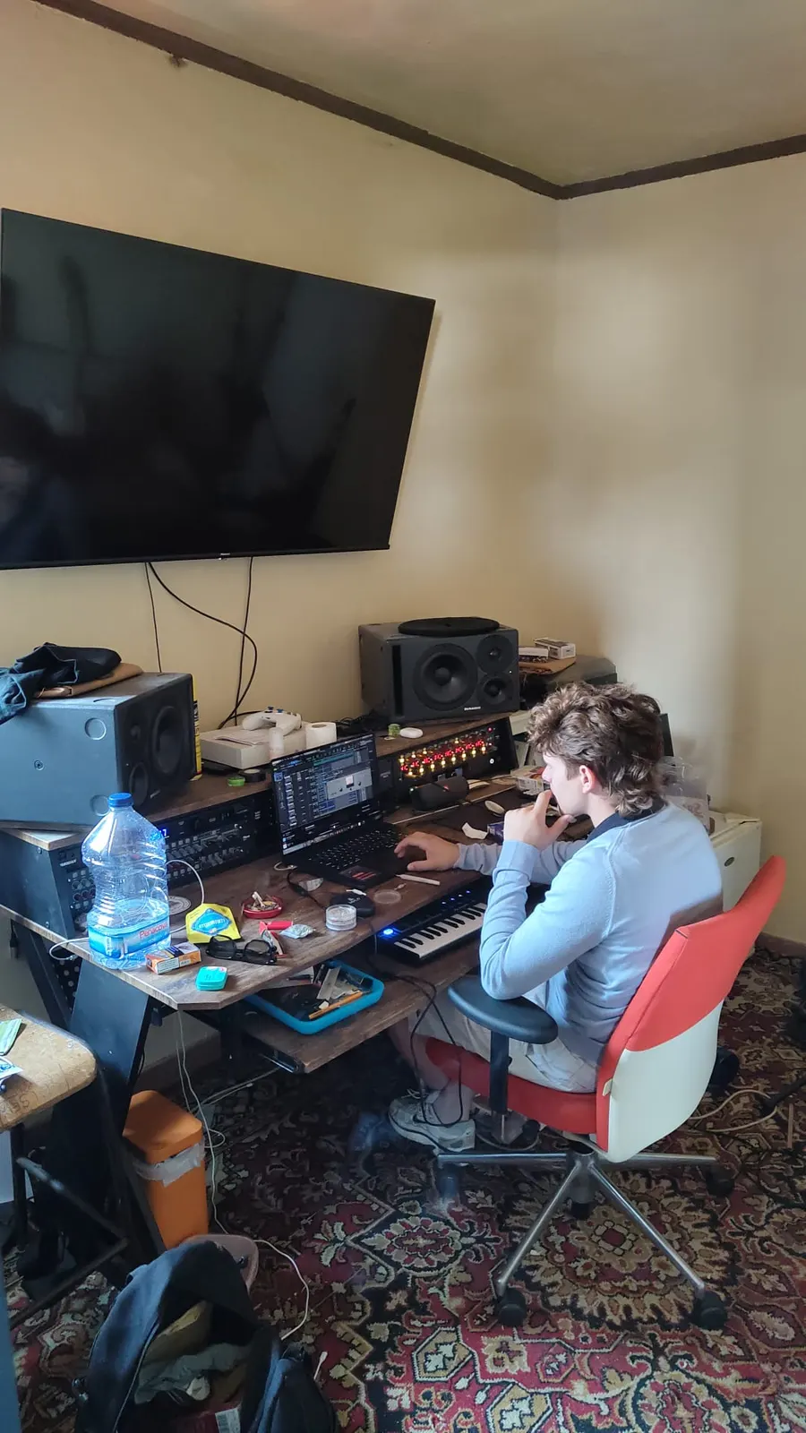 Sadhäna band member producing music in the home studio